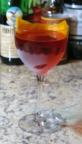 Eeyore's Requiem cocktail with an orange twist garnish