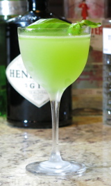 Gin Basil Smash Cocktail with a sprig of basil for garnish