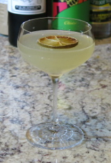Illegal Margarita cocktail garnished with a desiccated lime wheel