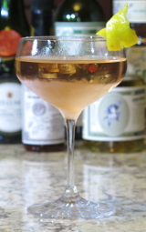 Merry Widow cocktail garnished with a lemon twist