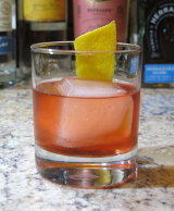 Oaxaca Old Fashioned cocktail with an orange twist for garnish
