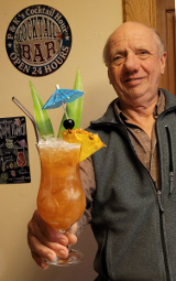 Peter serves a Planter's Punch cocktail