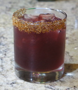 Mezcal Hibiscus Margarita on the rocks with Taijin rim